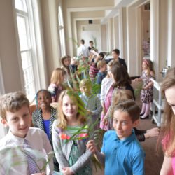 Children hold palms as they line up to parade through the sanctuary on Palm Sunday