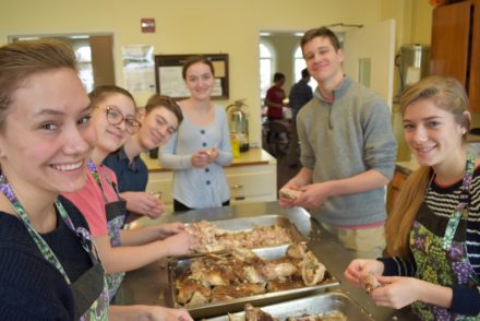 Youth prepare food for SouperBowl of Caring lunch