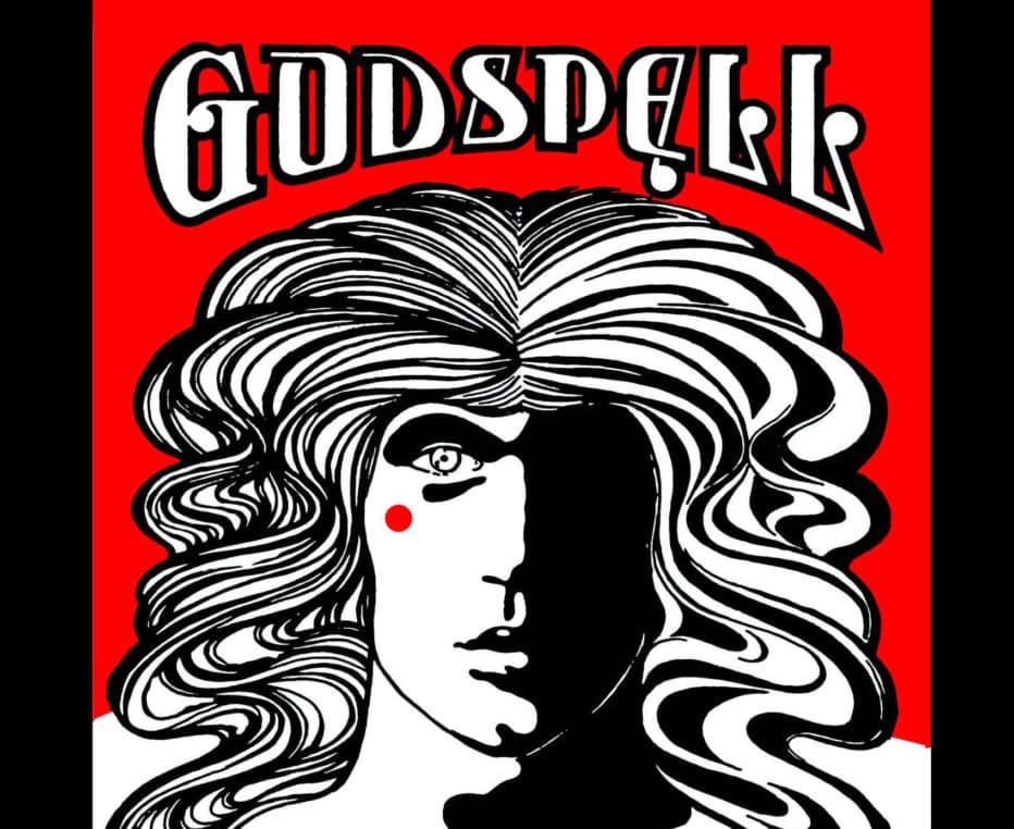 The GODSPELL playbill with a drawing of a person with flowing hair