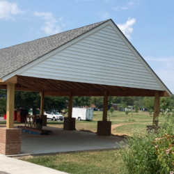 CPC's pavilion has a covered roof supported by columns with brick bases.