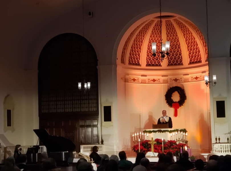 Rev. Kovacs preaches from the pulpit on Christmas Eve.