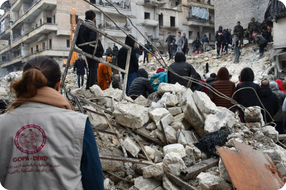Aid workers in building rubble