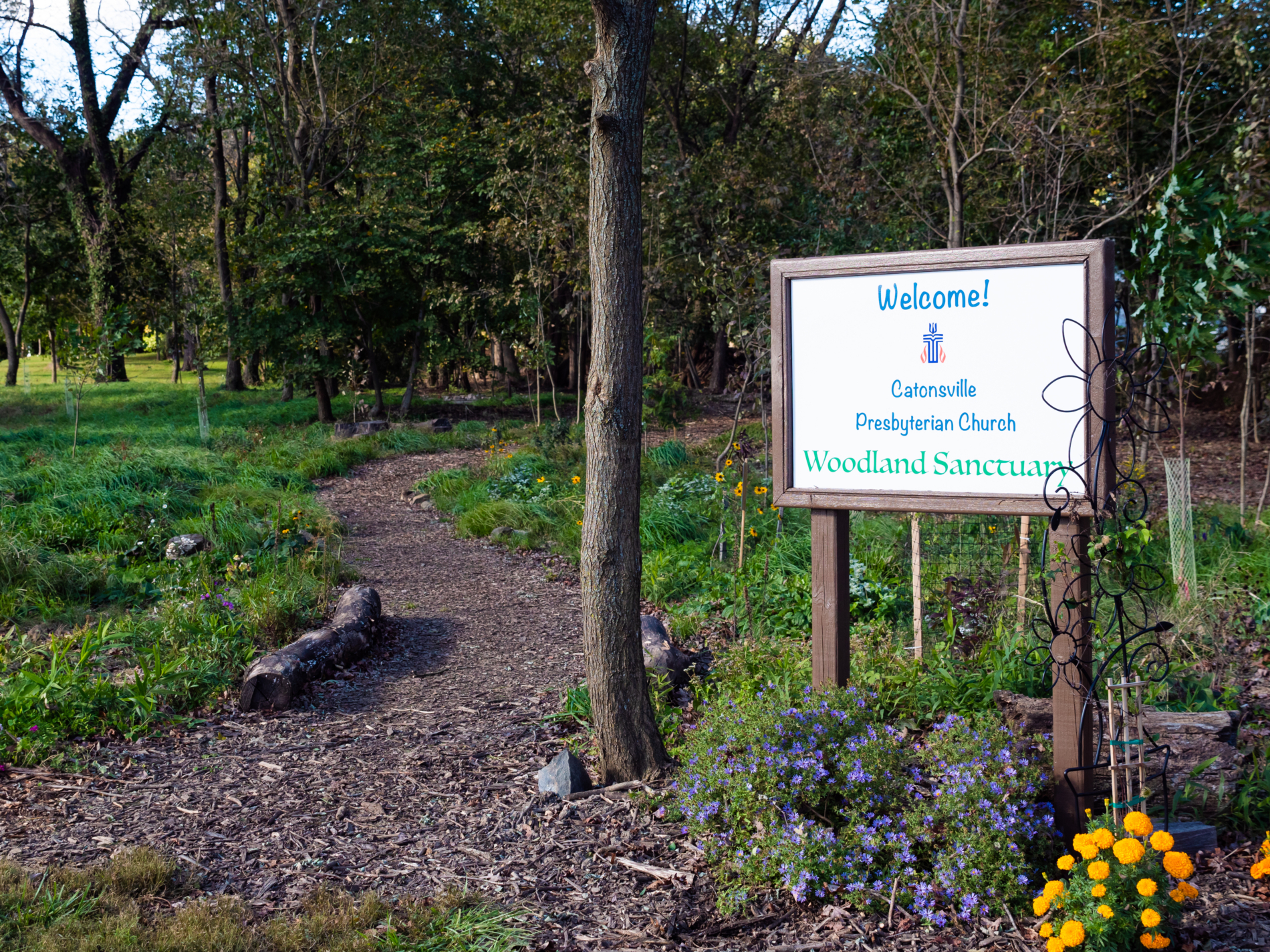 Welcome sign to woodland sanctuary