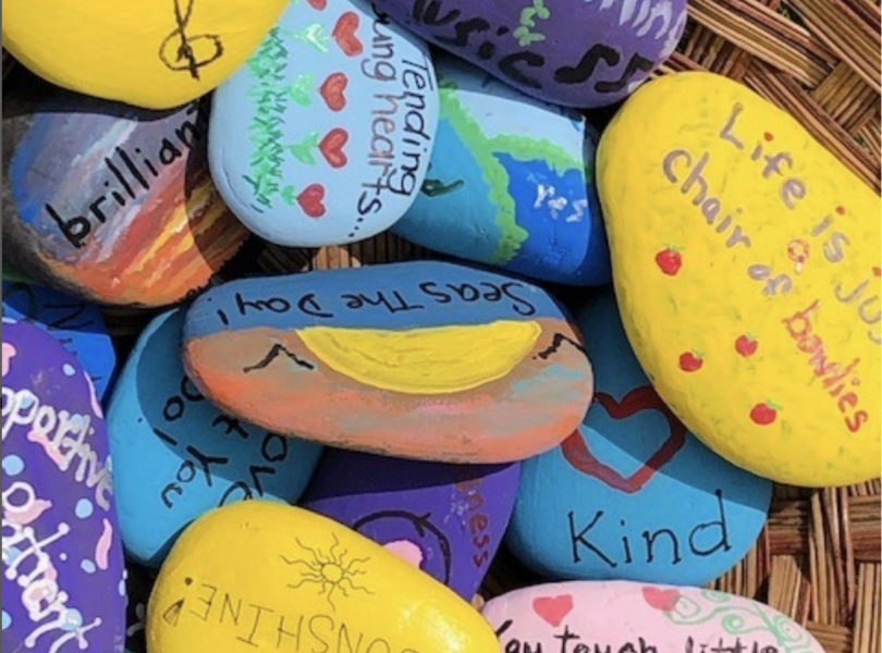 Multicolored rocks with painted affirmations