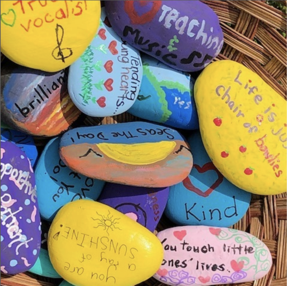 Multicolored rocks with painted affirmations