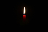 Lone candle burning